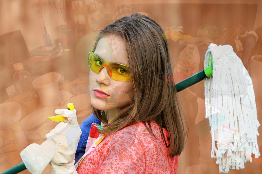 a person holding a mop stick
